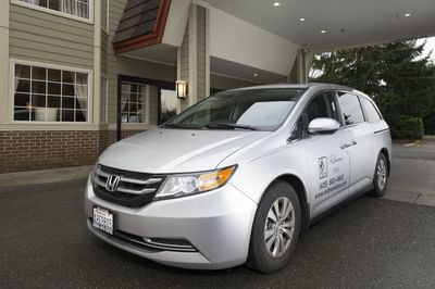 Redmond Inn's shuttle parked in the portcochere