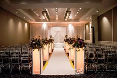 glowing pillars light a wedding reception