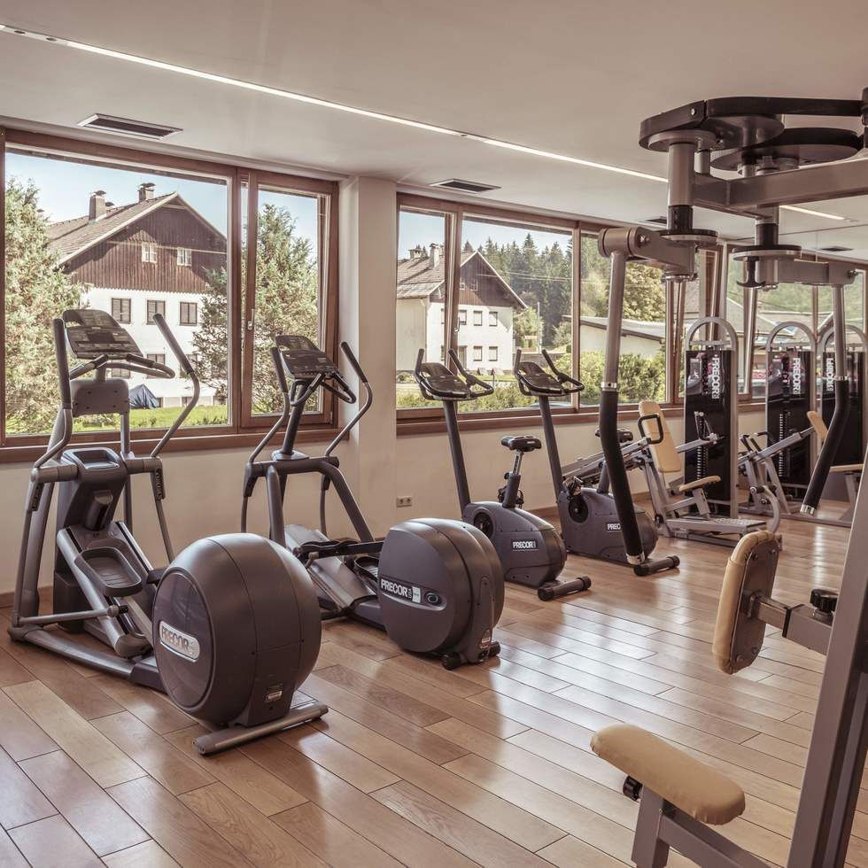 Fitness room with exercise machines at Falkensteiner Hotels