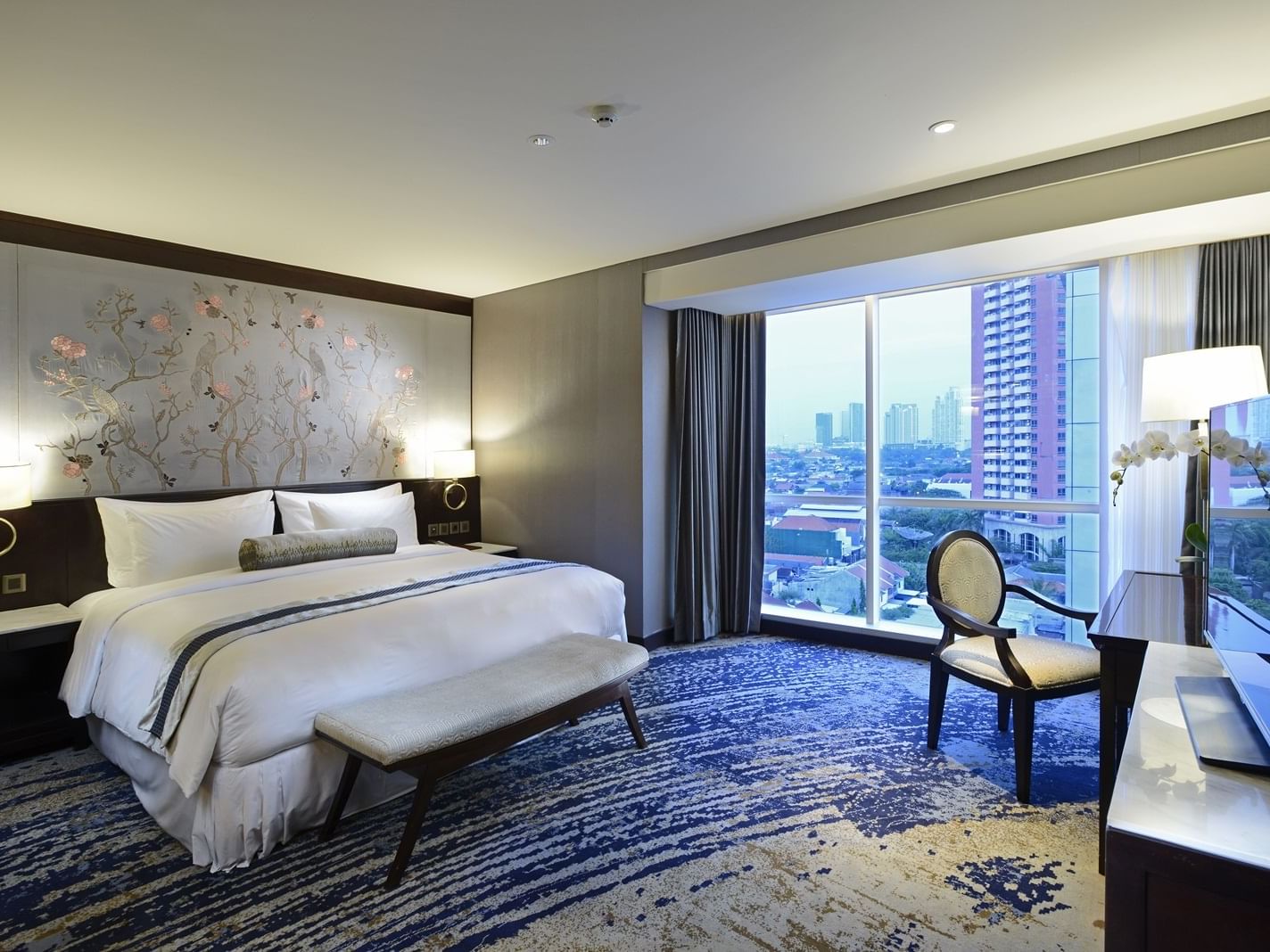 Bedroom of Breccia Suite with a king bed in Vasa Hotel Surabaya