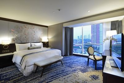 Breccia Suite with a king bed & TV at Vasa Hotel Surabaya