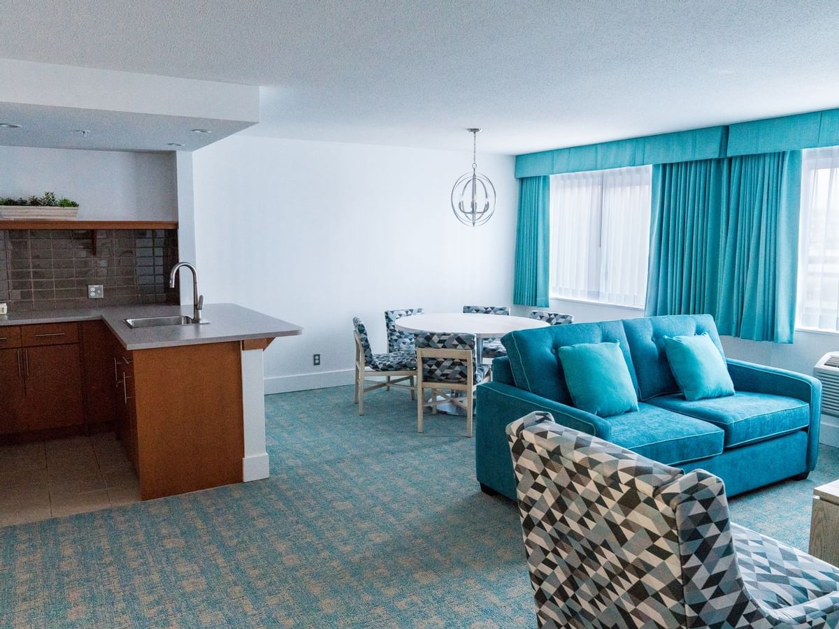 Sofa and kitchen in hotel suite