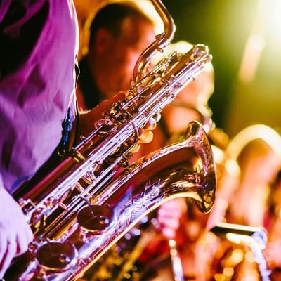 Close-up of a man playing saxophones at The Rimones live performance near Falkensteiner Hotel Schladming