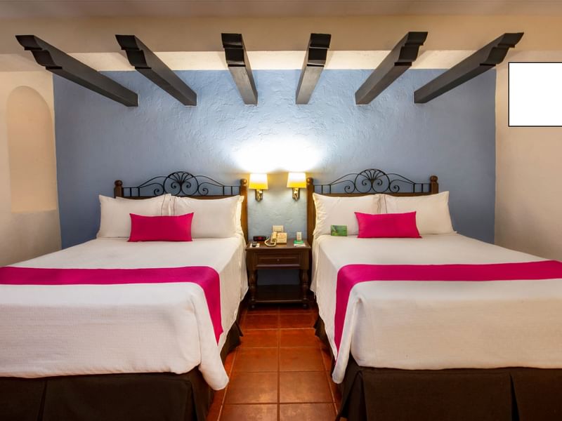 Twin beds in Junior Suite Double at Gamma Hotels