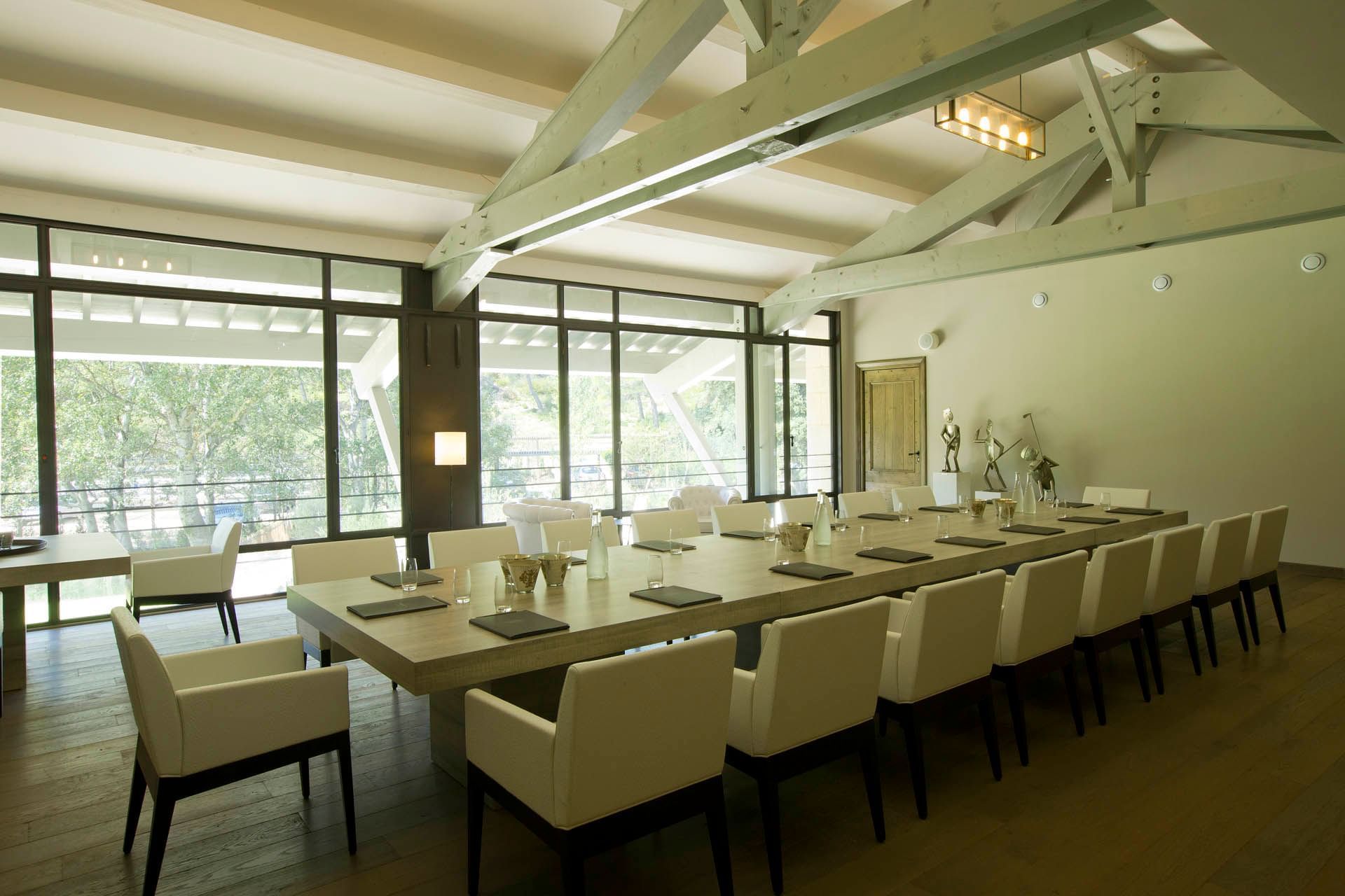 Well-arranged table in meeting room at Domaine de Manville