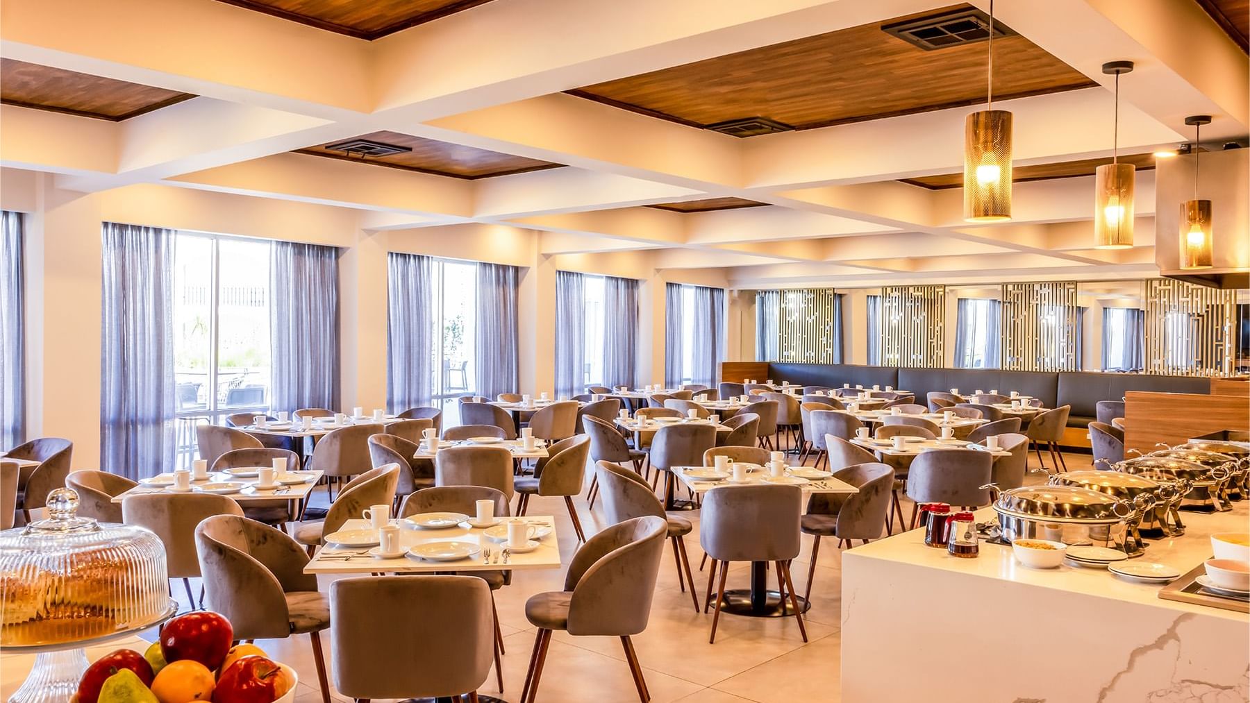 Dining tables arranged in the Restaurant at Gamma Ciudad Juarez