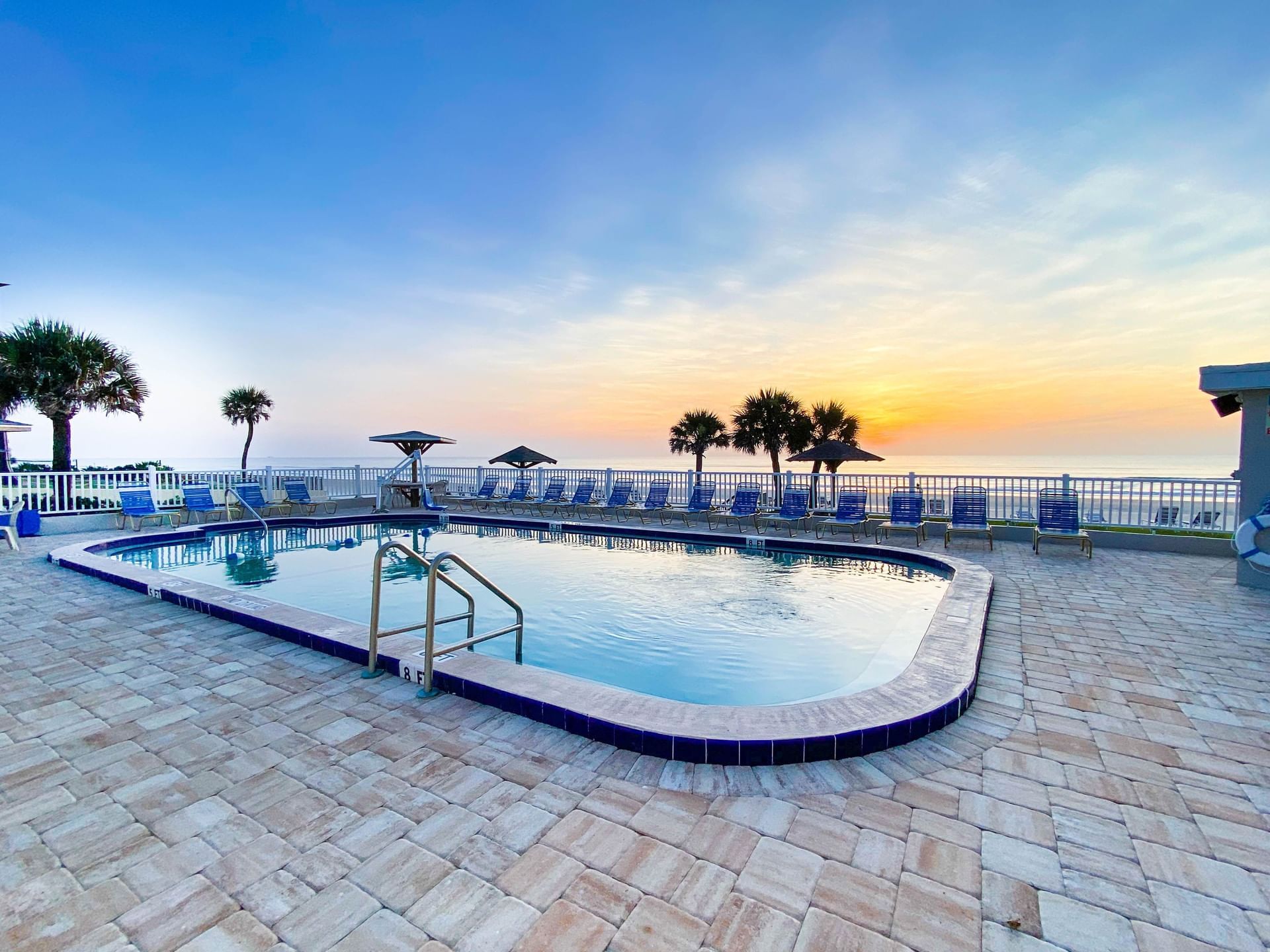 Evening View of Outdoor pool at  Ocean Court Beachfront Hotel