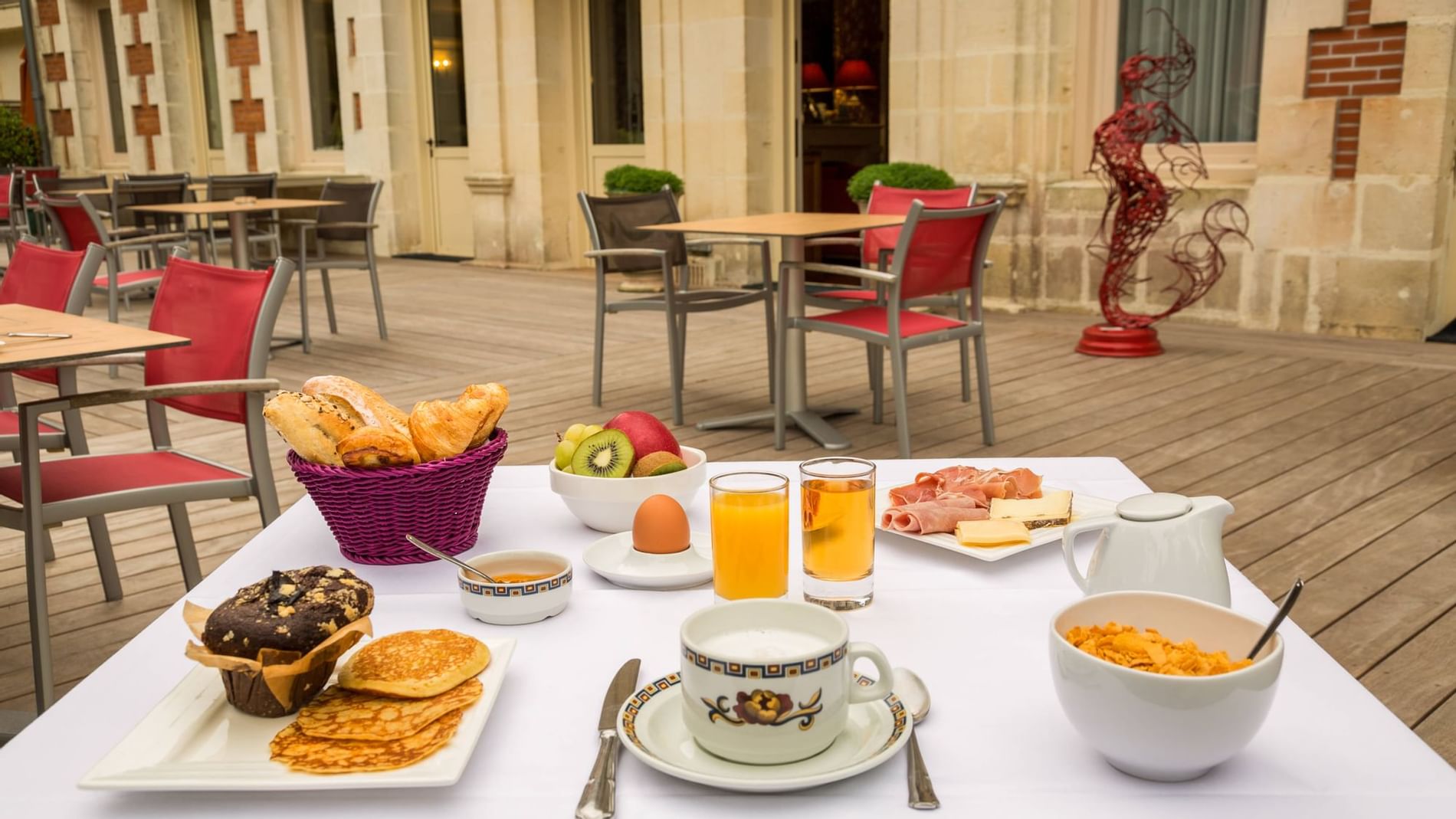 Breakfast & drinks with an outdoor view at The Originals Hotels