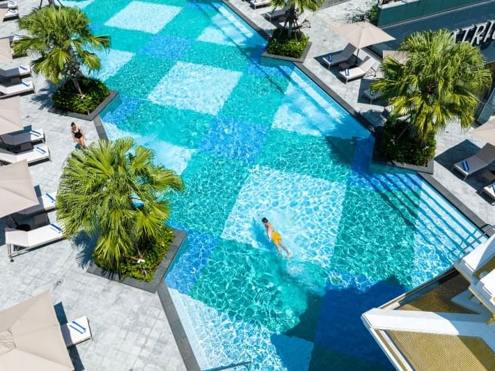 High-angle view of the infinity pool & sunbeds, Chatrium Hotels
