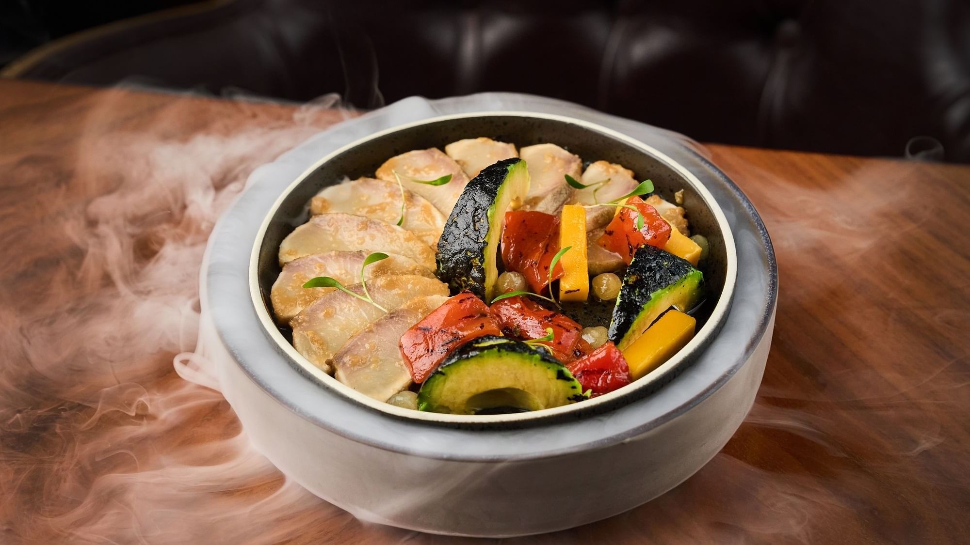 Sliced pork served with avocado in Pacific Groove Restaurant & Lounge at Paramount Hotel Dubai