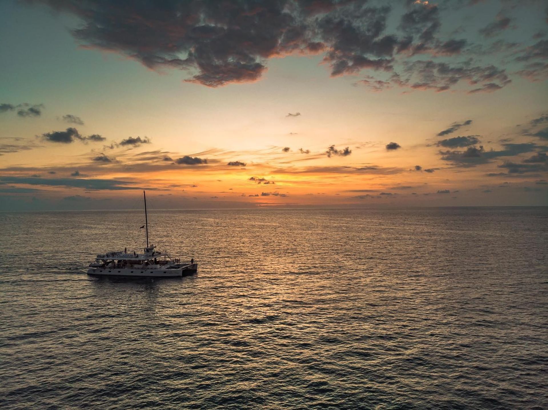 Yacht experience in the sea at sunset near Jungle Vista Boutique Hotel