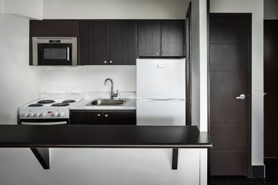 Small kitchen with appliances at Embassy Hotel & Suites Ottawa