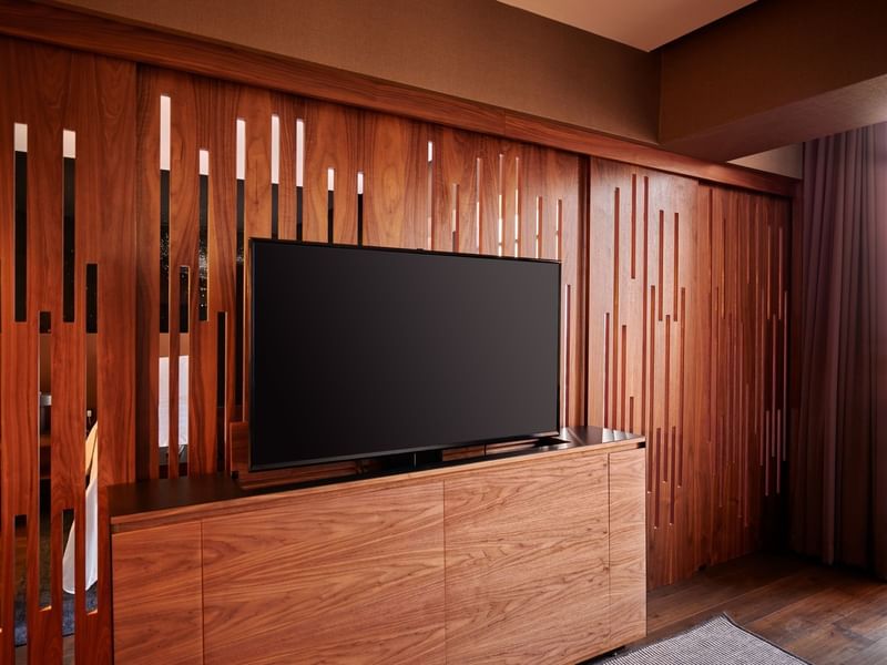 Wooden TV stand in Master suite at La Colección Resorts