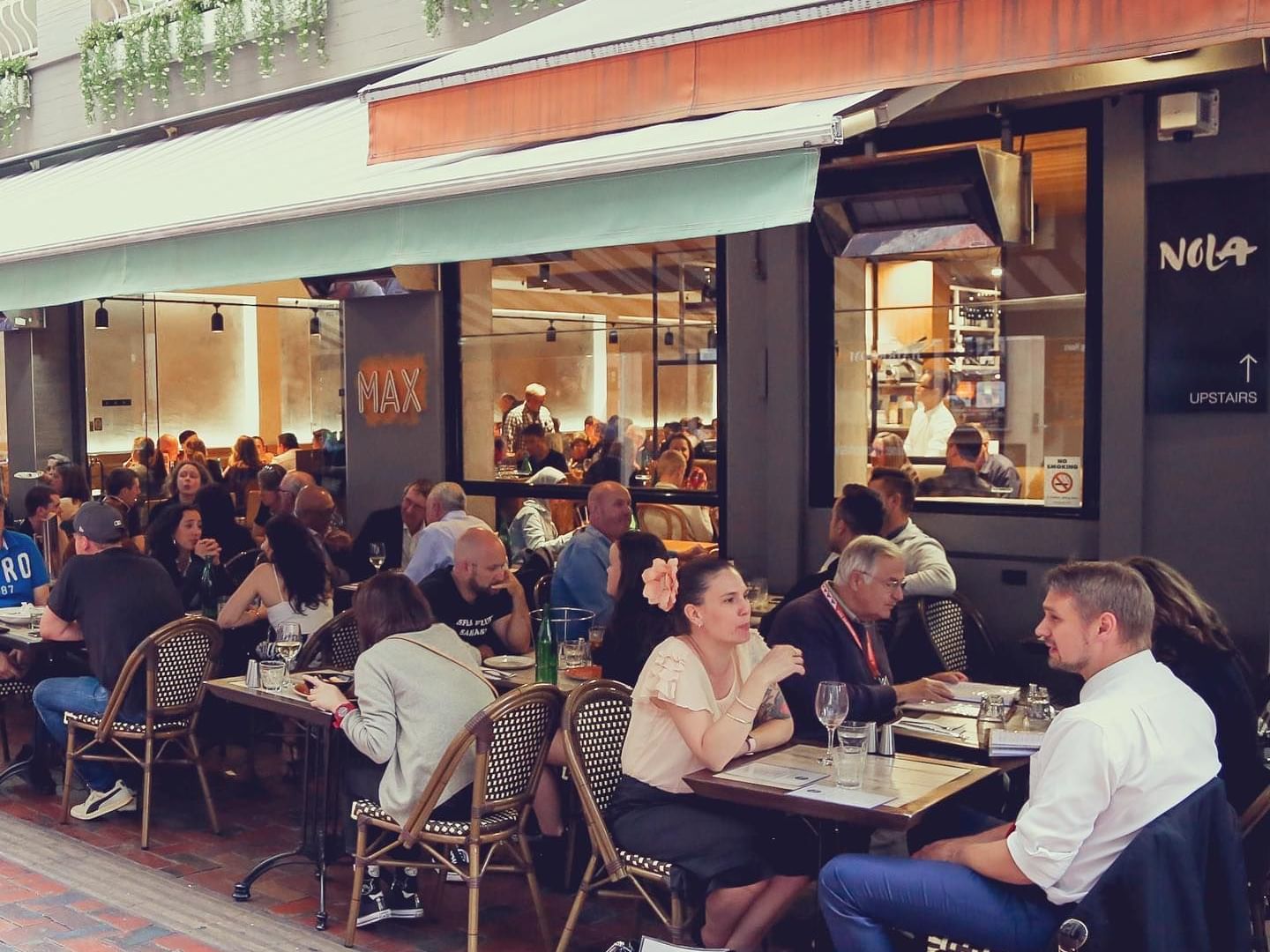 Close up on people dining in restuarant at Brady Hardware Lane