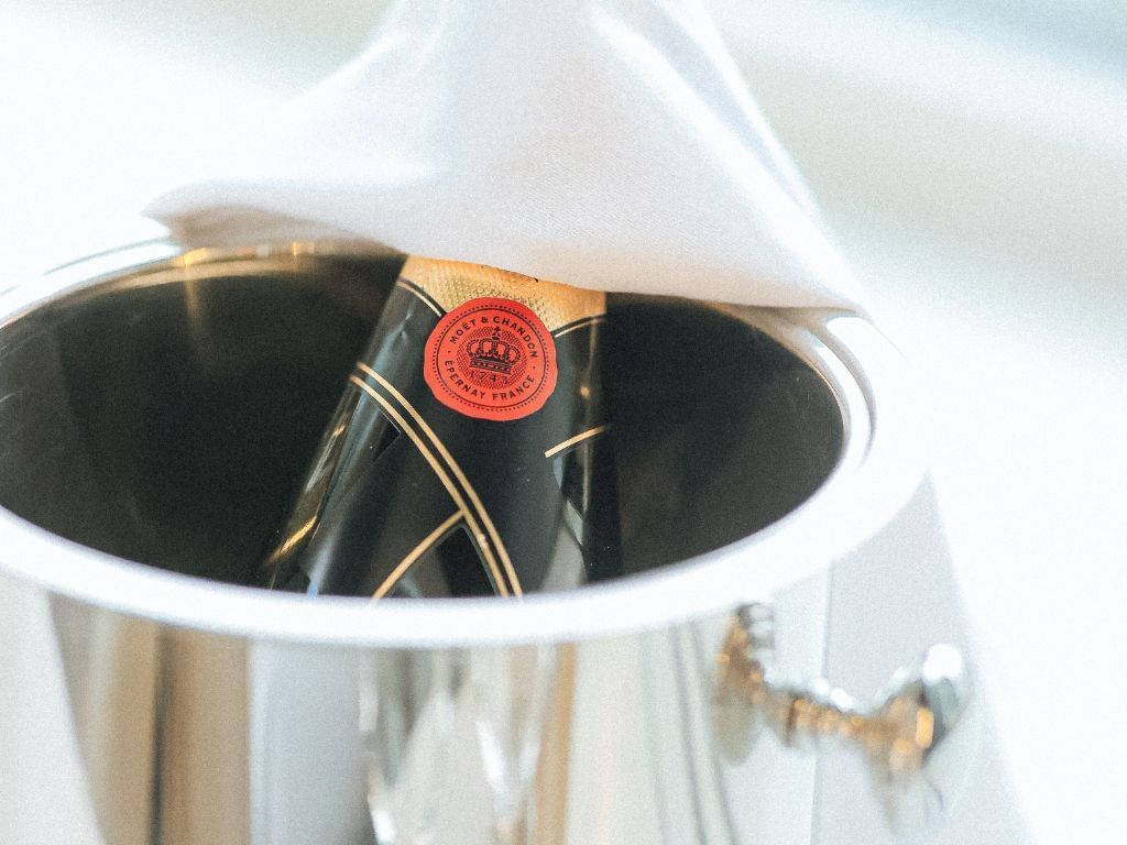 A champagne bottle served on a table at The Hotel Brussels