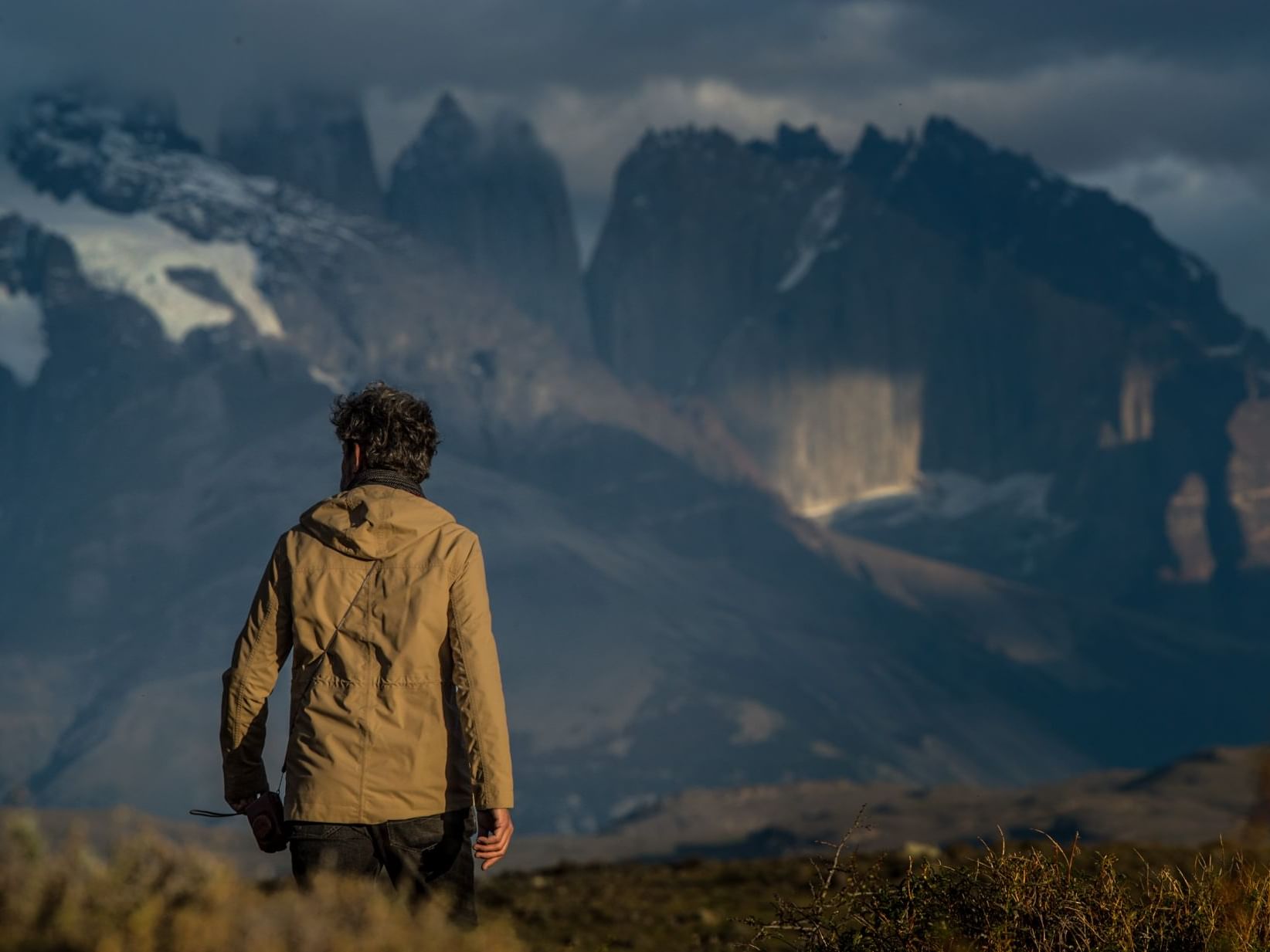 Close up of a man on a cliff near The Singular Patagonia