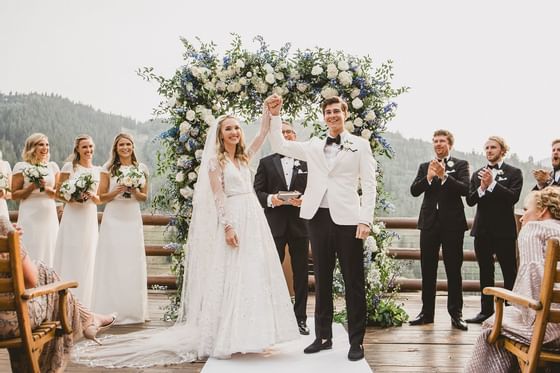 A newlywed couple at their wedding in Stein Eriksen Lodge