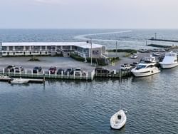 Aerial view of ferries parked by the dock near Falmouth Tides