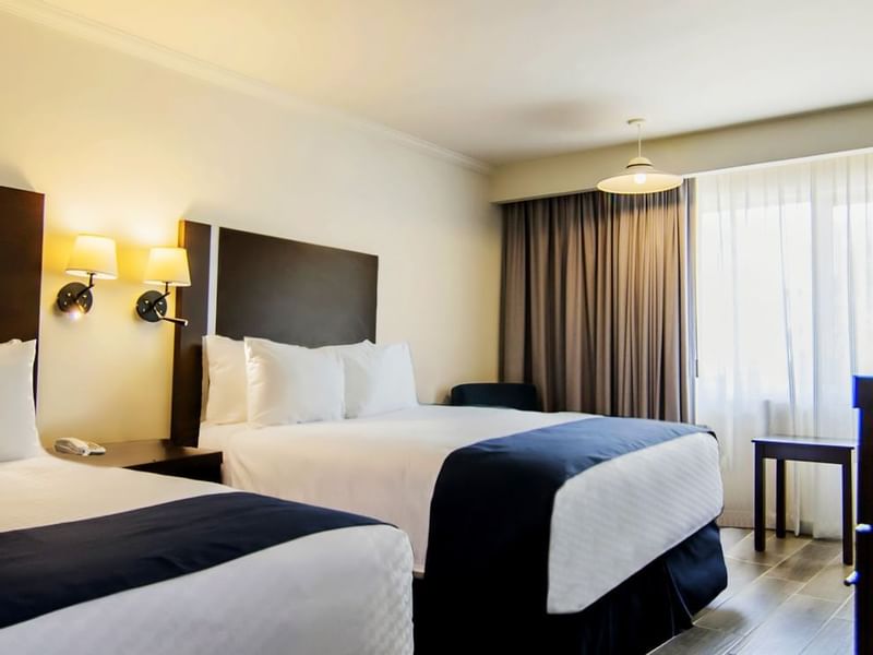 Large beds in the Superior Double Room at Gamma Hotels