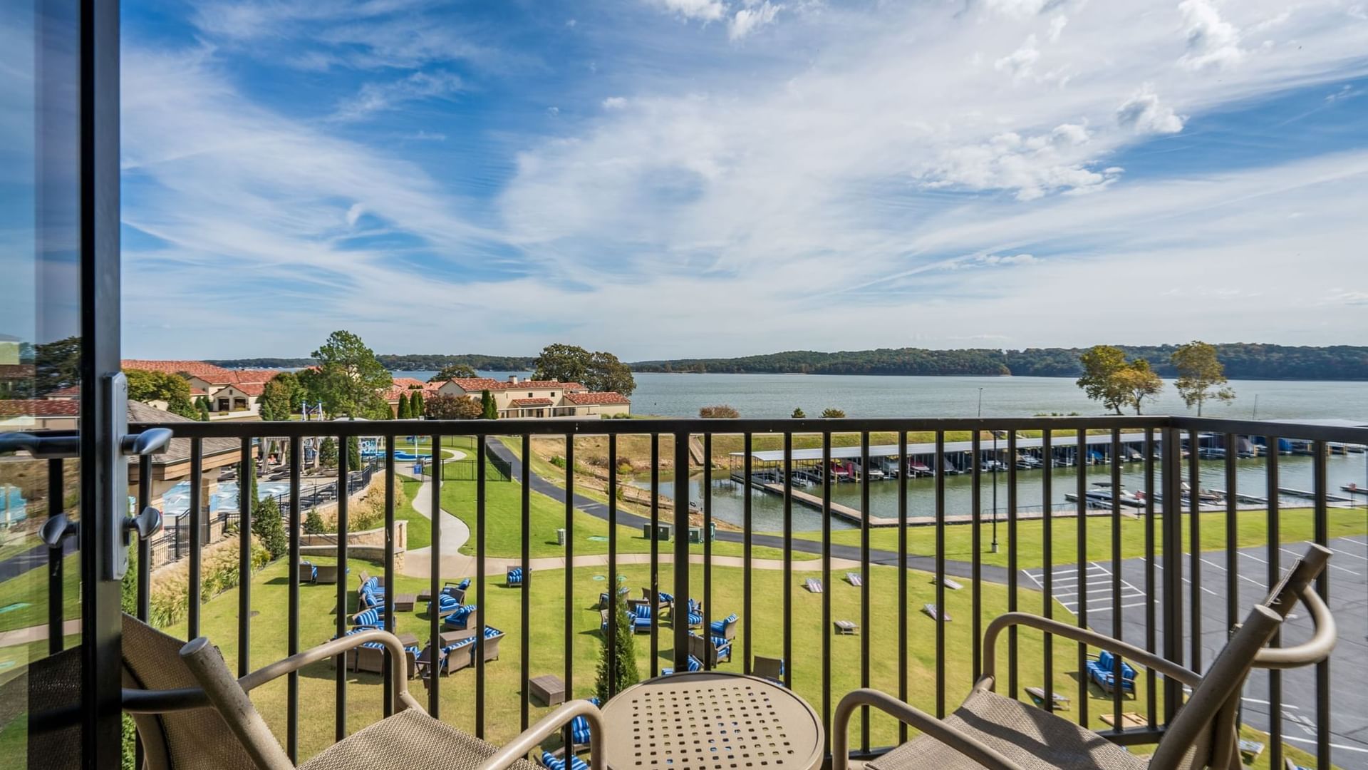 King studio balcony view featuring a serene lake and lush green lawns at Shangri-La Monkey Island