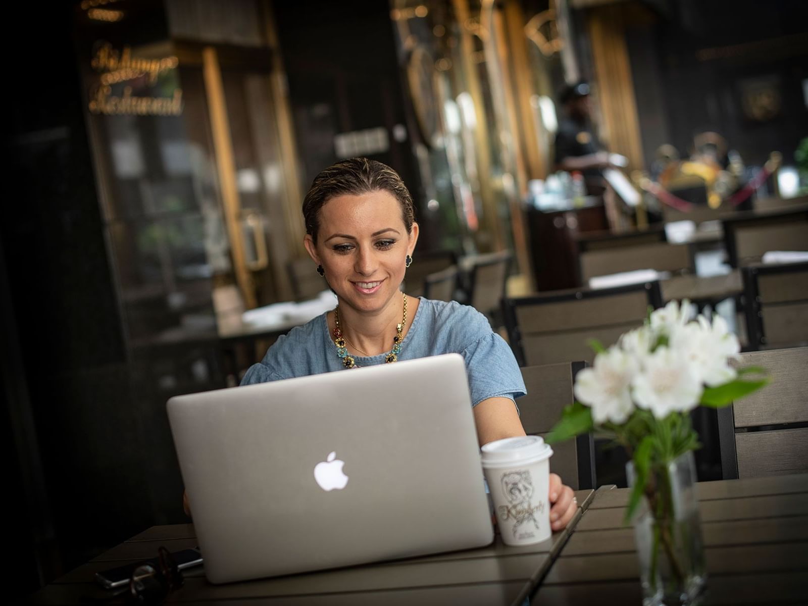 Lady working on a laptop at Kimberly Hotel
