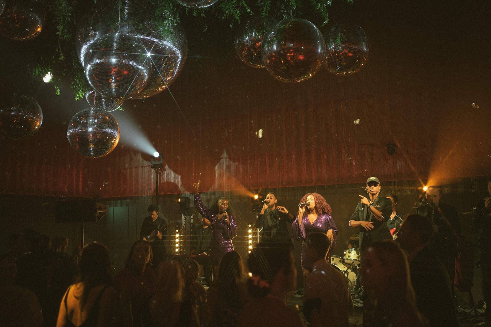 Indoor musical performance by Chloe Elliot in the ballroom featuring elegant lighting decor at The Londoner Hotel