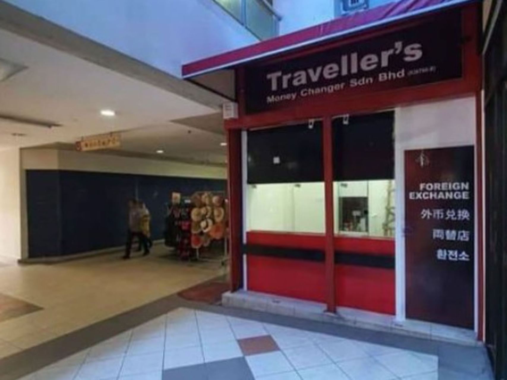 Money Changer storefront with a red and white signboard near Cititel Express Kota Kinabalu