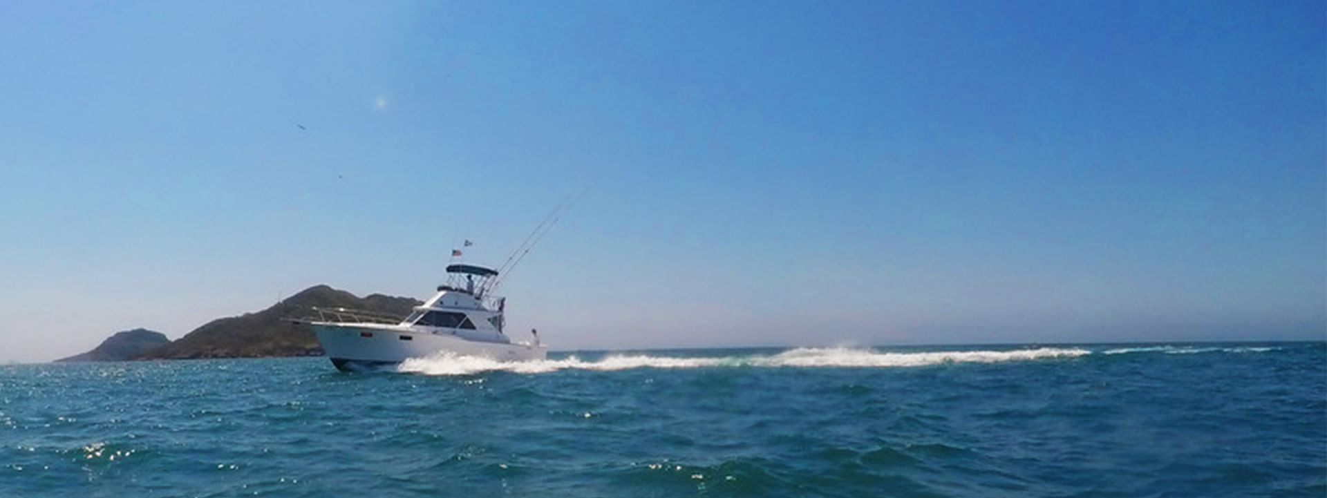 Boat going in the ocean near Viaggio Resort Mazatlan