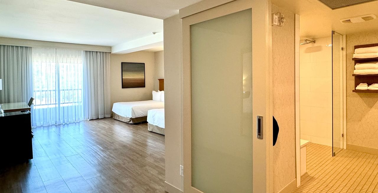 Accessible hotel guestroom with two queen beds