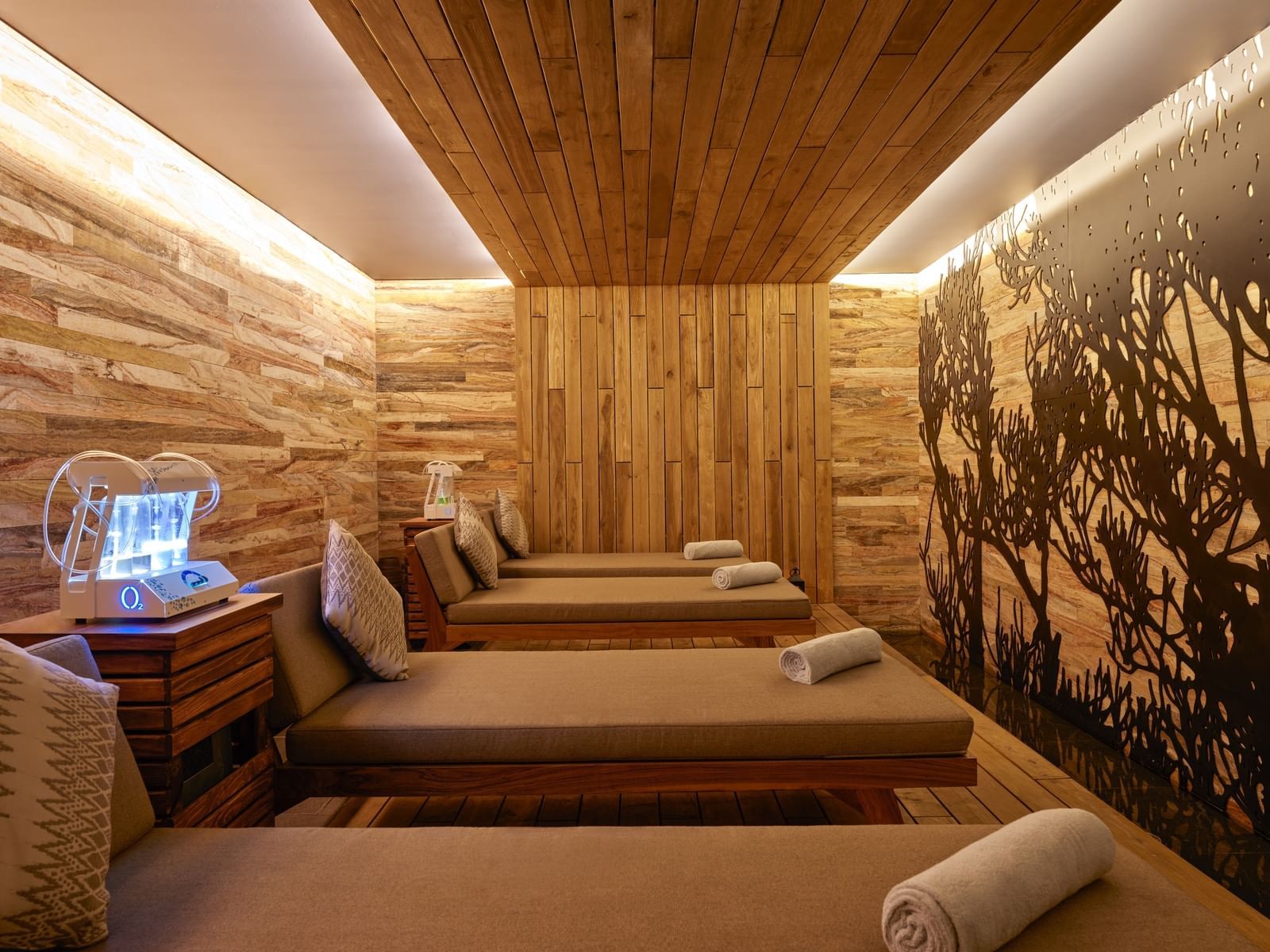 Massage beds with a towel roll at Live Aqua Resort spa