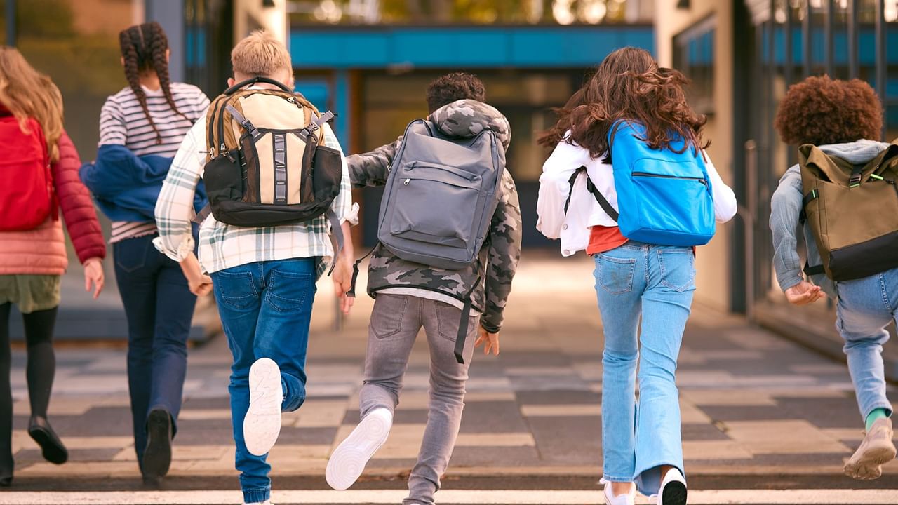 group of high school kids running