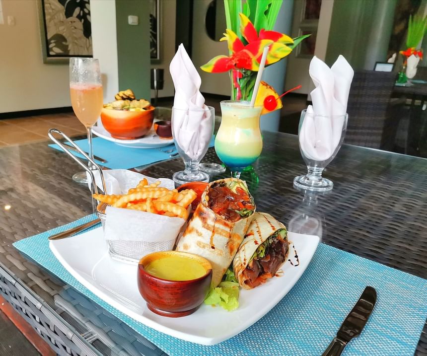 Shawarma & fries served on a dining table at Jungle Vista Boutique Hotel