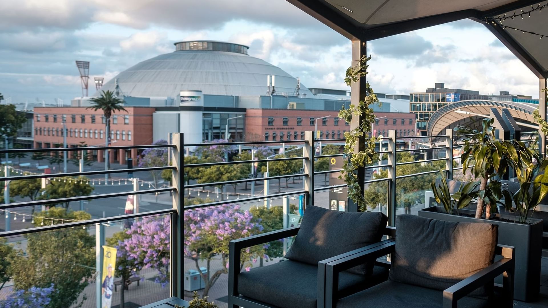 Balcony lounge area with a view at Novotel Sydney Olympic Park