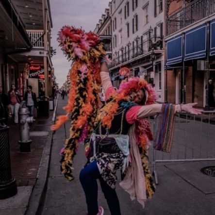 A performer dancing in the street near Hotel St. Pierre
