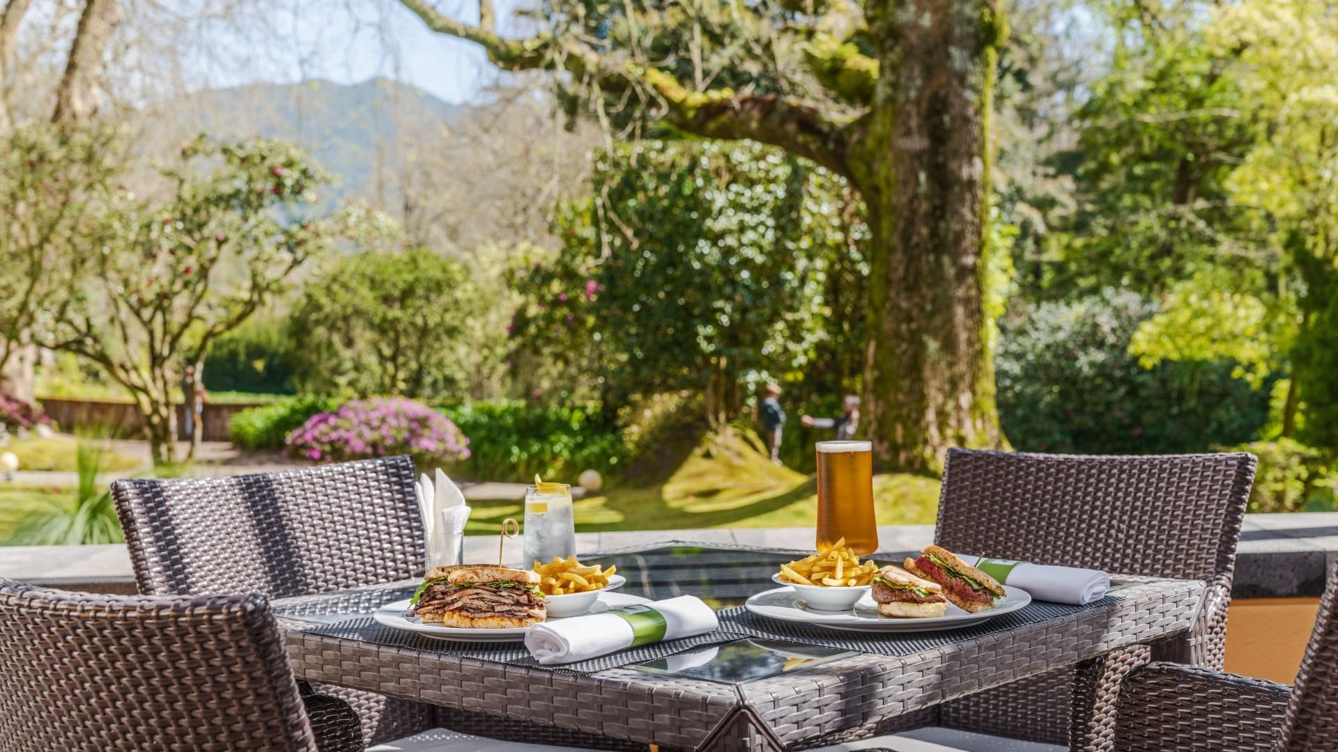 Burgers with a side of fries & beer served in The Gardner at Terra Nostra Garden Hotel