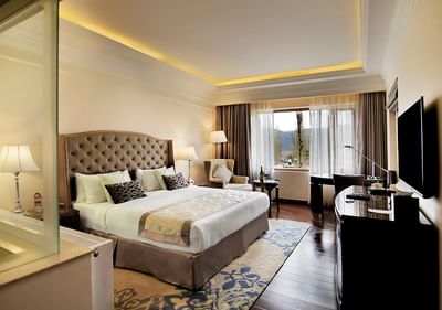 TV stand facing the king bed in Classic Room at The Indus Valley Leh, Five Star Hotel in Leh Ladakh