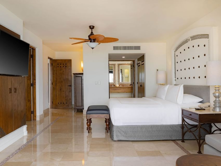 Spacious and bright room with a comfy bed and a TV in Casita Eden Suite at Marquis Los Cabos Resort