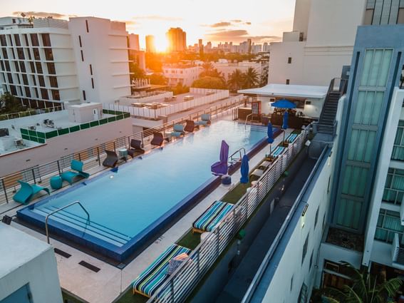 Aerial view of the Rooftop Pool with sun loungers at Fairwind Hotel Miami
