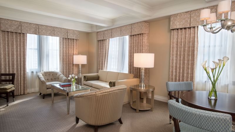 Dining area and lounge area in The Avenue One Bedroom Suite at Warwick New York