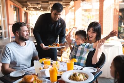 Family enjoying meal served at Hotel Coral y Marina