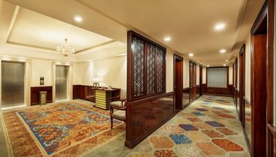 Elevators in the lobby with carpeted floors at The Indus Valley