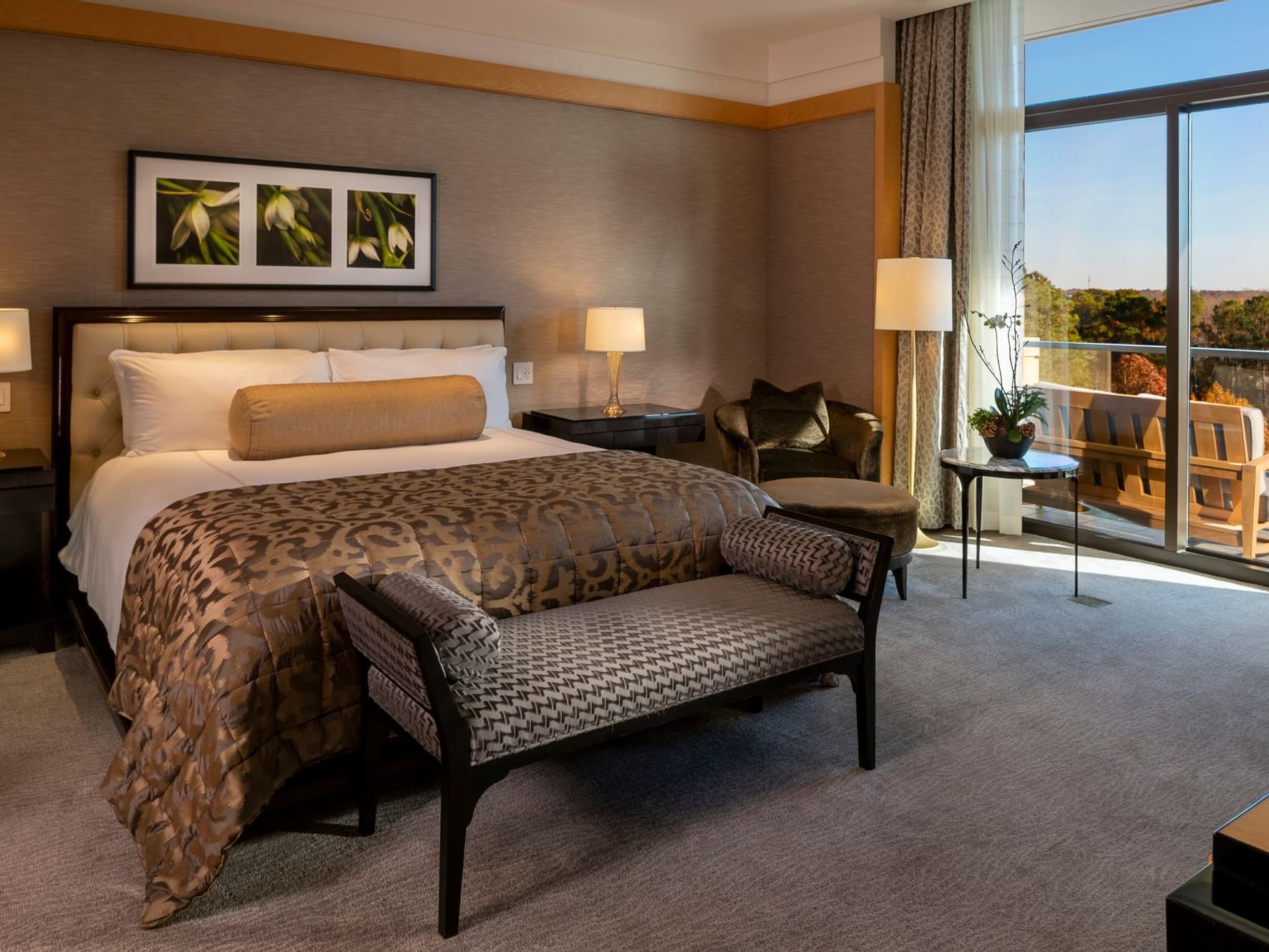 Cozy interior with a balcony overlooking the lake and gardens in Presidential Suite at The Umstead Hotel and Spa