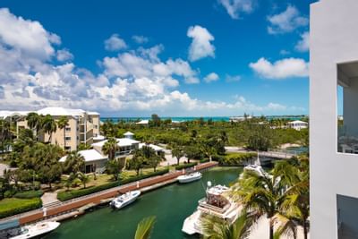 View of the canal and boats from Zenza Hotel small luxury hotel in Providenciales with marina views