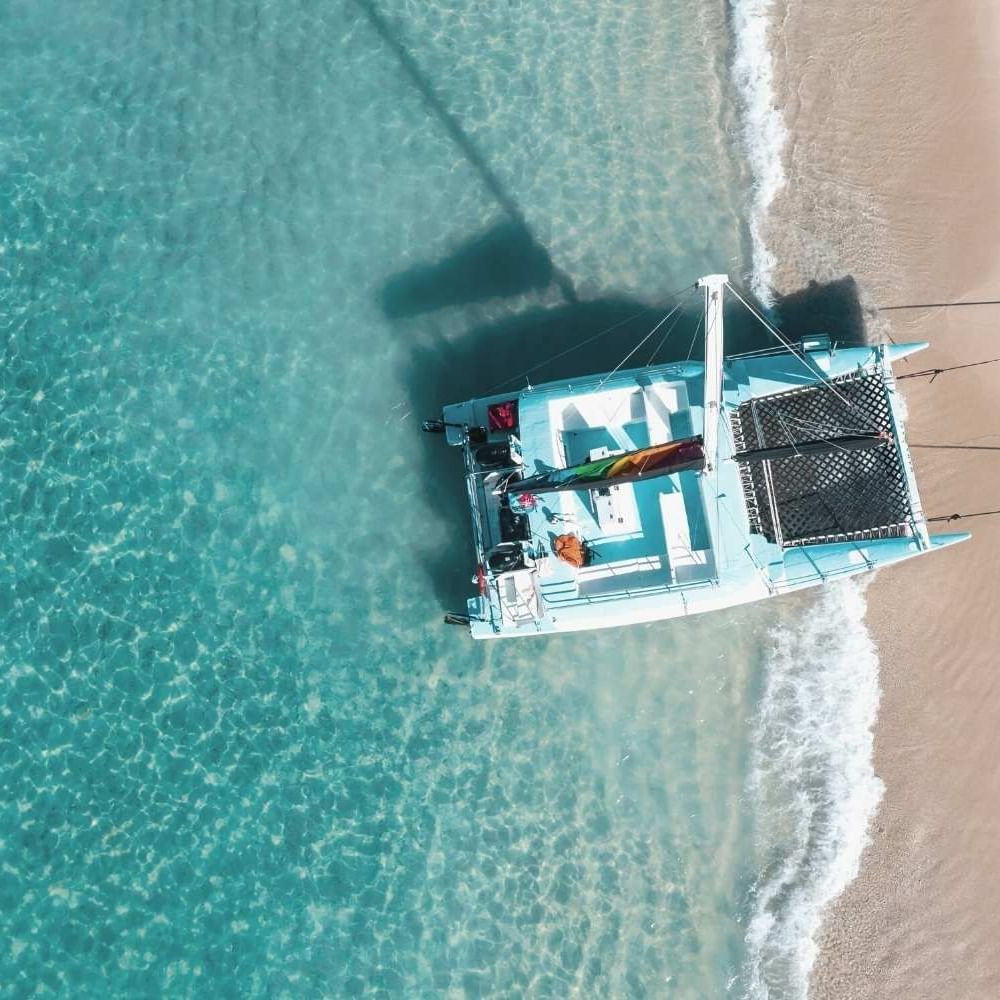Aerial view of a catamaran docked in the sea near Waikiki Resort Hotel by Sono