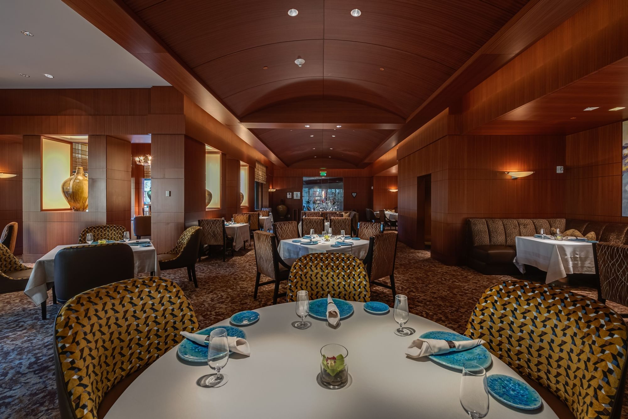 Dining room featuring a round table surrounded by chairs at Umstead Hotel and Spa