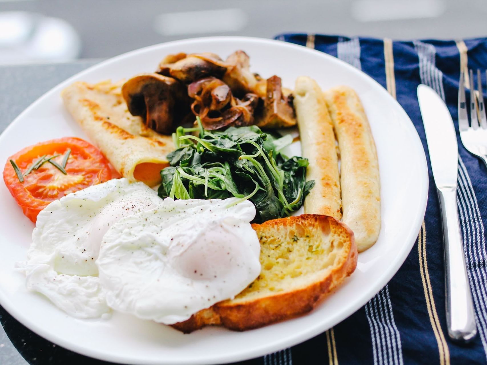 Close-up of breakfast served with sausage and egg at Hotel Grand Chancellor Adelaide