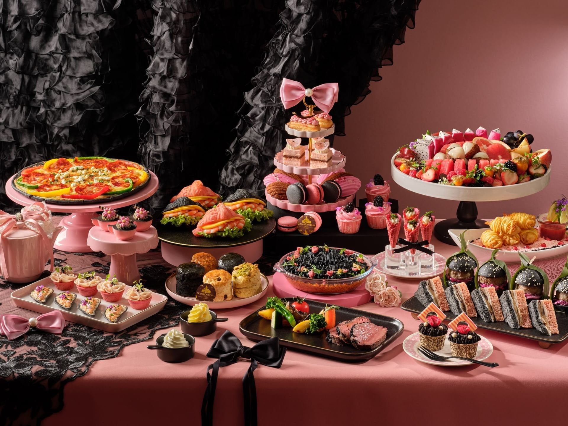 An abundant and stylish afternoon tea buffet with a pink and black theme at the prestigious Goodwood Park Hotel