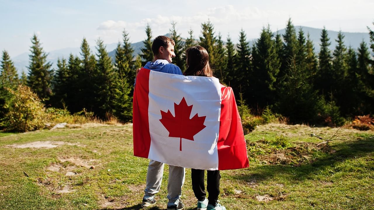 Couple holding a Canadian flag