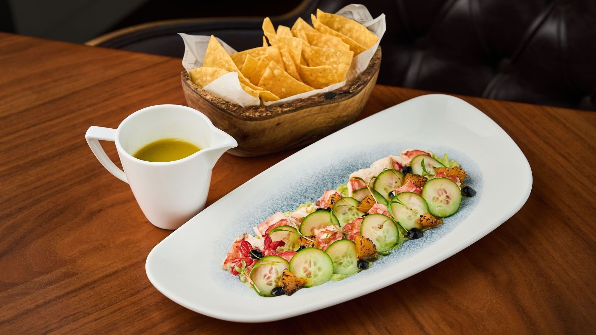 Cucumber sunomono salad & chips served in Pacific Groove Restaurant & Lounge at Paramount Hotel Dubai