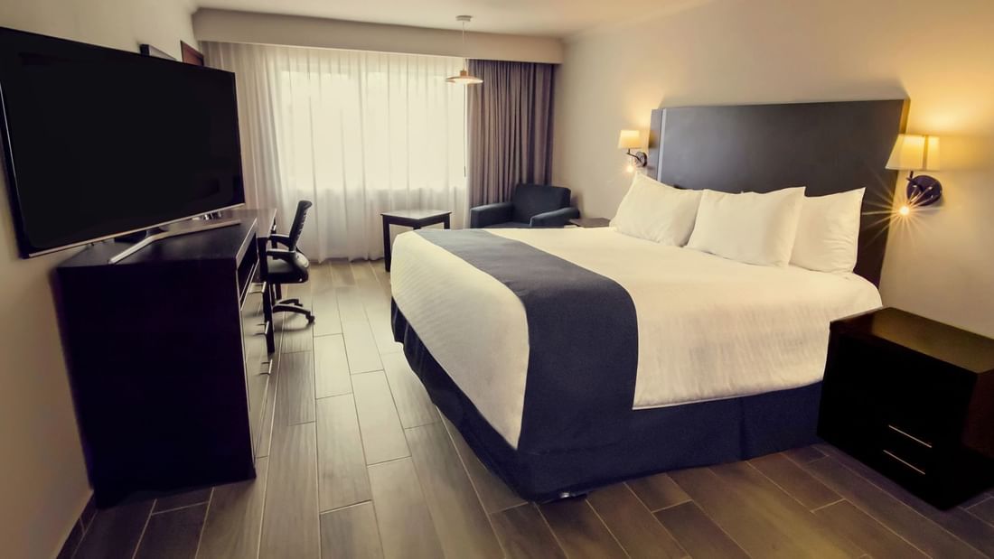 Accessible Room with bed & TV station at Gamma Hotels